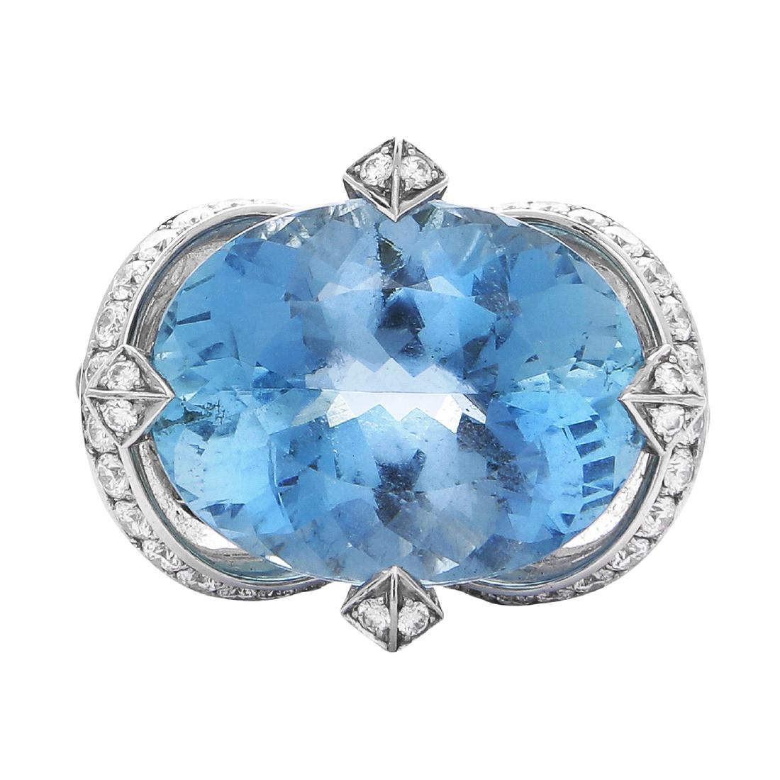 AN AQUAMARINE, DIAMOND AND MOONSTONE RING BY STEPHEN: AN AQUAMARINE, DIAMOND AND MOONSTONE RING BY STEPHEN WEBSTER in 18ct white gold, the large oval cut aquamarine of 30.25 carts raised within a diamond and moonstone jewelled mount, signed SW and number