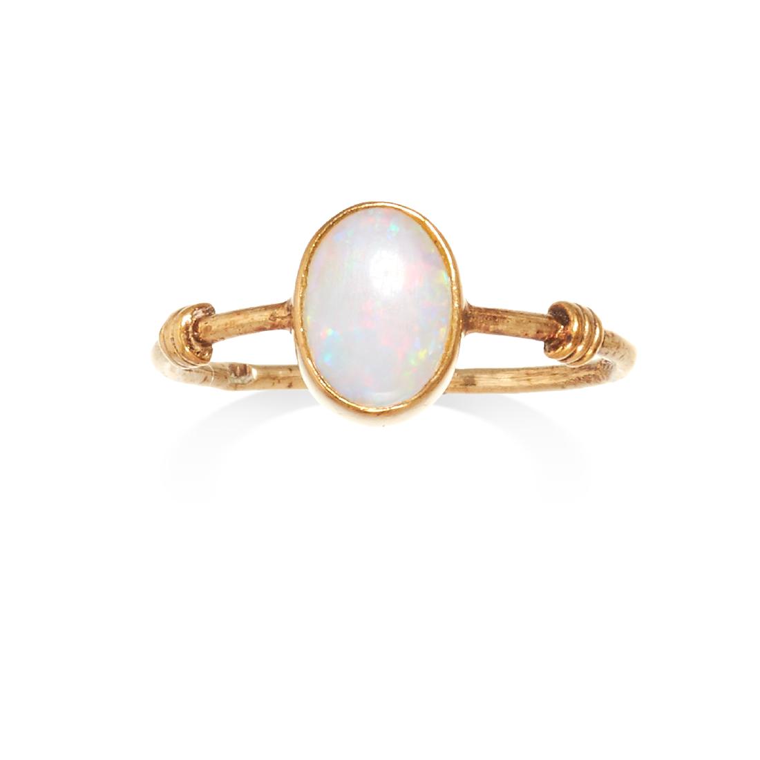 AN OPAL DRESS RING in yellow gold, the oval cabochon (1 of 1)