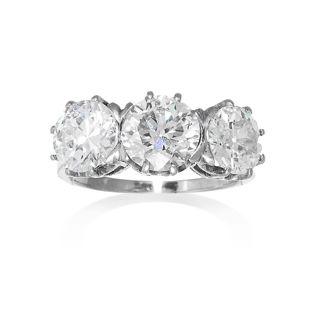 A 3.89 CARAT THREE STONE DIAMOND RING in white gold or (1 of 1)