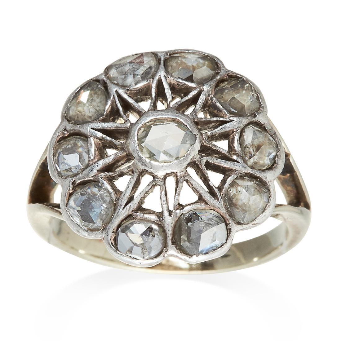 AN ANTIQUE DIAMOND DRESS RING in white gold or: AN ANTIQUE DIAMOND DRESS RING in white gold or platinum, ten rose cut diamonds set in an openwork design, unmarked, size N / 6.75, 4.85g.