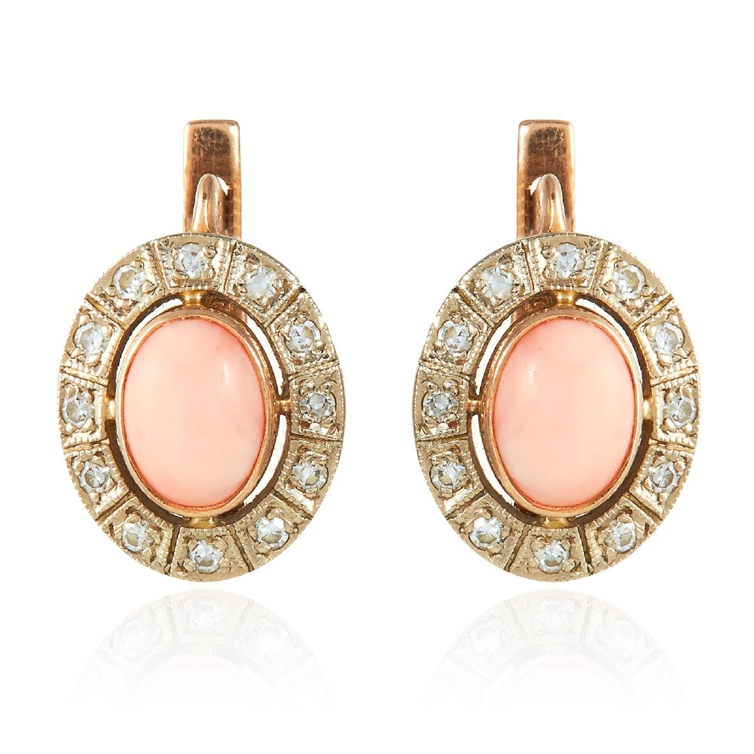 A PAIR OF CORAL AND DIAMOND EARRINGS in yellow gold,: A PAIR OF CORAL AND DIAMOND EARRINGS in yellow gold, each oval cluster with coral at the centre, unmarked, 1.7cm, 6.7g.