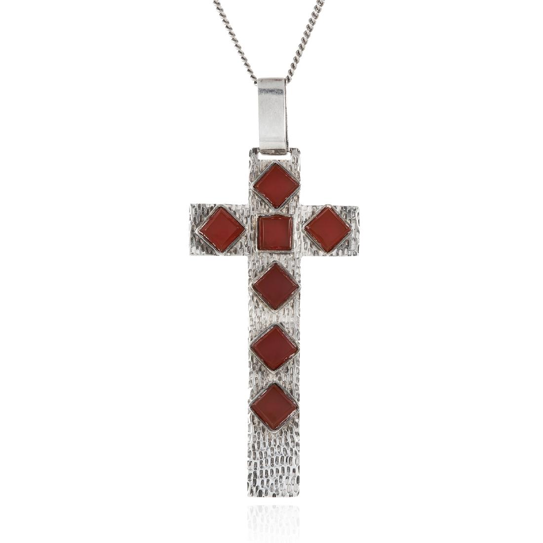 A CARNELIAN SILVER CROSS PENDANT in silver, comprising: A CARNELIAN SILVER CROSS PENDANT in silver, comprising of a cross jewelled with polished carnelian, 7.5cm, 14.1g.
