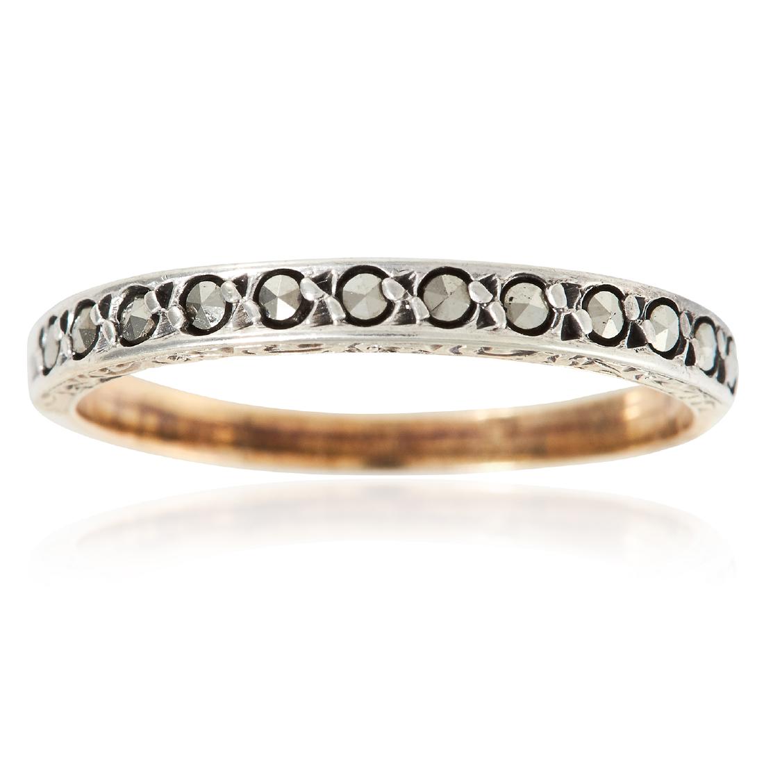 AN ANTIQUE MARCASITE RING in yellow gold, set with a: AN ANTIQUE MARCASITE RING in yellow gold, set with a single row of marcasite, unmarked, size O / 7, 1.5g.