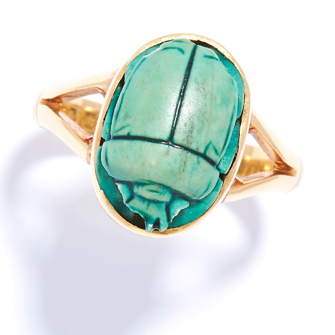 A CARVED SCARAB HARD STONE RING in 18ct yellow gold, (1 of 1)