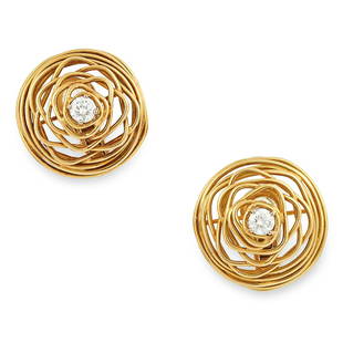 A DIAMOND CLIP EARRINGS, ANDREW GRIMA, CIRCA 1970 each: A DIAMOND CLIP EARRINGS, ANDREW GRIMA, CIRCA 1970 each of open wirework design set with a round cut diamond, totalling 0.90 carats, signed Grima, stamped 750, 2.8cm, 22.1g.