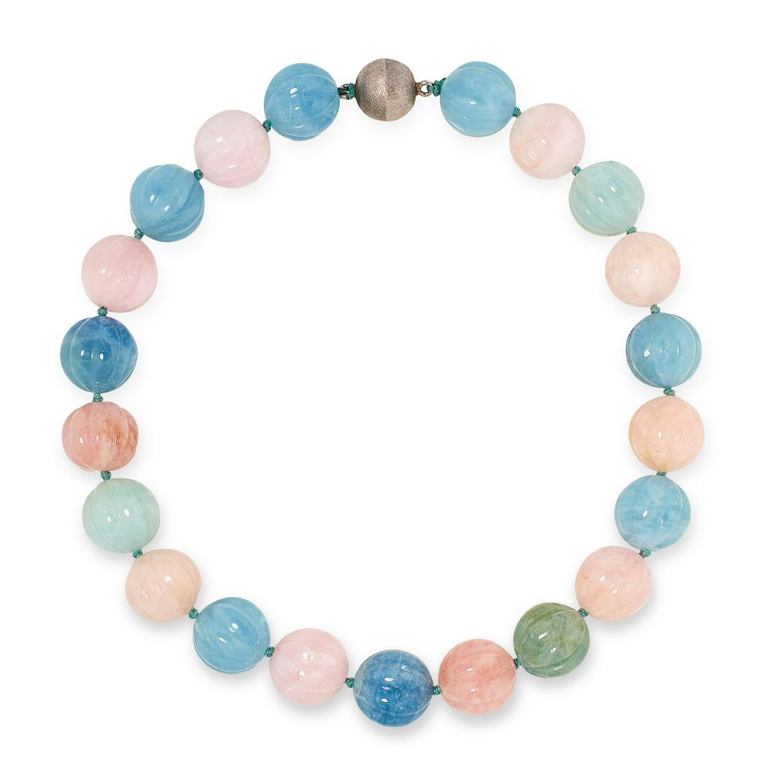 A MORGANITE AND AQUAMARINE MELON BEAD NECKLACE: A MORGANITE AND AQUAMARINE MELON BEAD NECKLACE comprising of alternating carved aquamarine and morganite beads, 48cm, 221.4g.