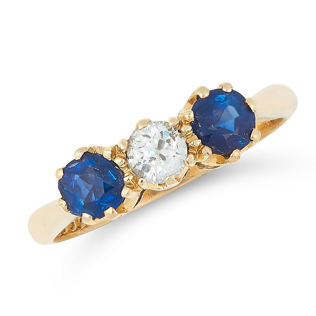 A SAPPHIRE AND DIAMOND DRESS RING in 18ct yellow gold,: A SAPPHIRE AND DIAMOND DRESS RING in 18ct yellow gold, set with an old cut diamond between two round cut blue sapphires, stamped 18ct, size J / 4.75, 2.7g. All profits from the sale of this item withi