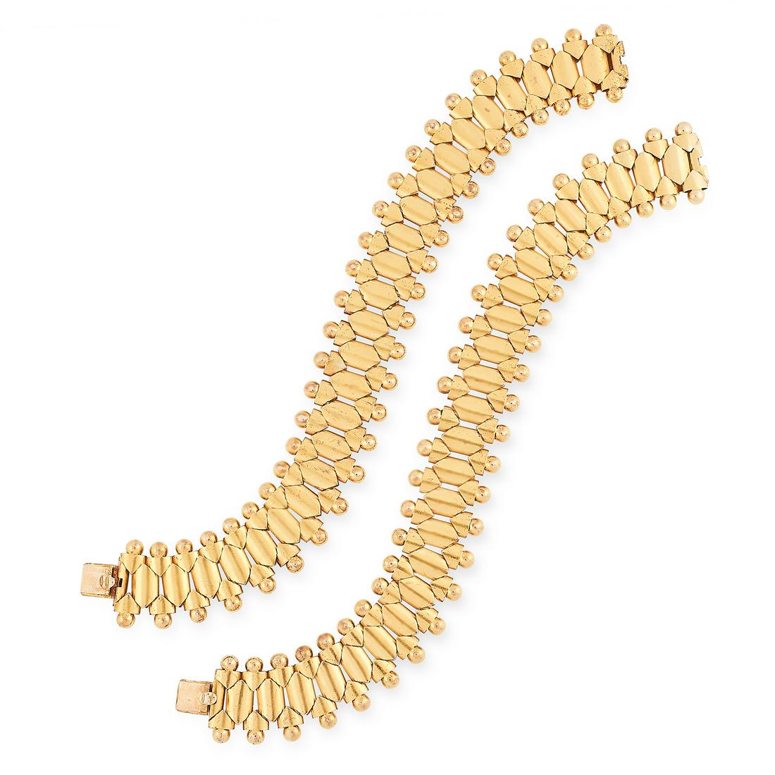 A PAIR OF ANTIQUE FANCY LINK BRACELETS, 19TH CENTURY in: A PAIR OF ANTIQUE FANCY LINK BRACELETS, 19TH CENTURY in high carat yellow gold, each formed of a row of bevelled links with beaded borders, joining together to form a necklace, unmarked, each bracelet
