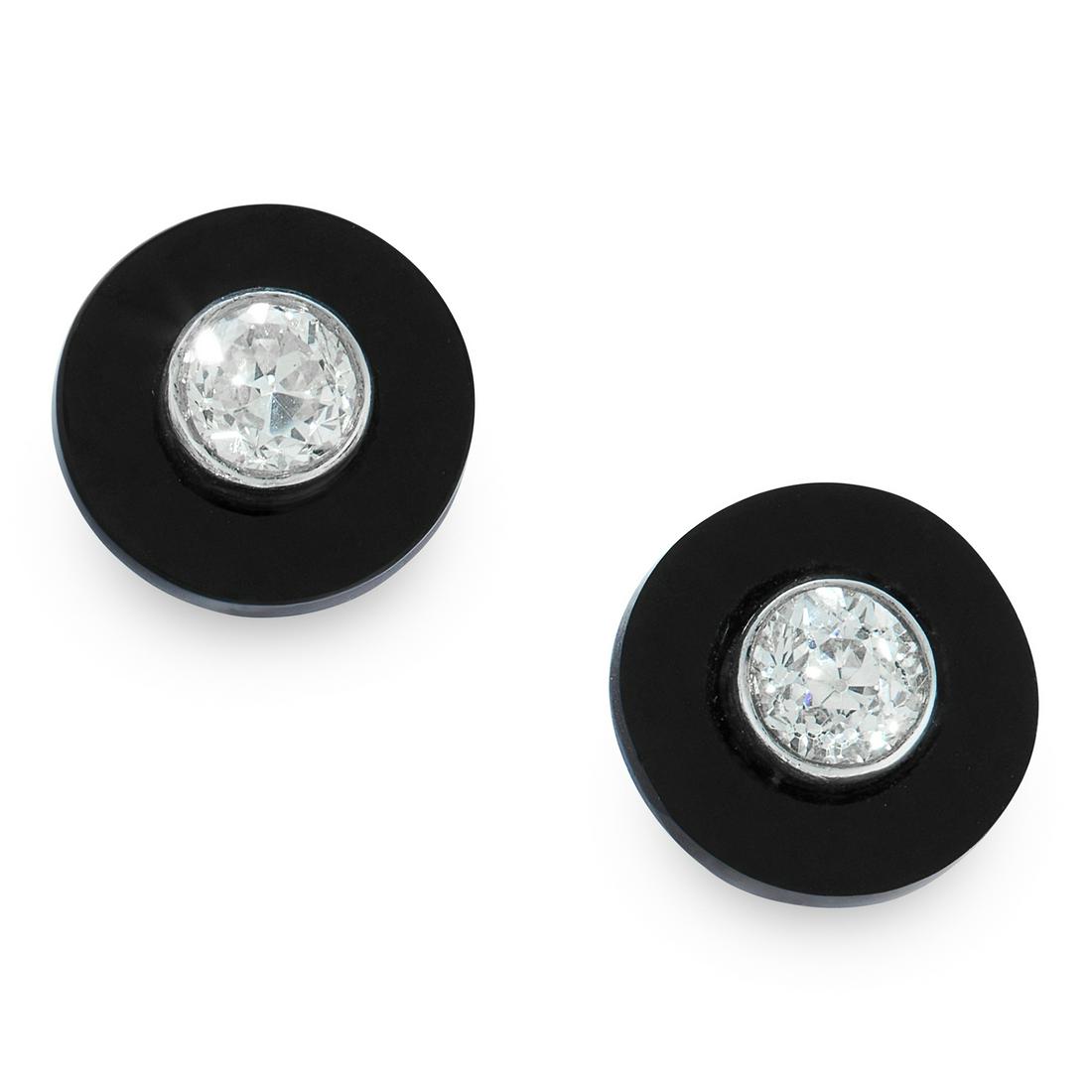 A PAIR OF ONYX AND DIAMOND STUD EARRINGS each formed of (1 of 1)
