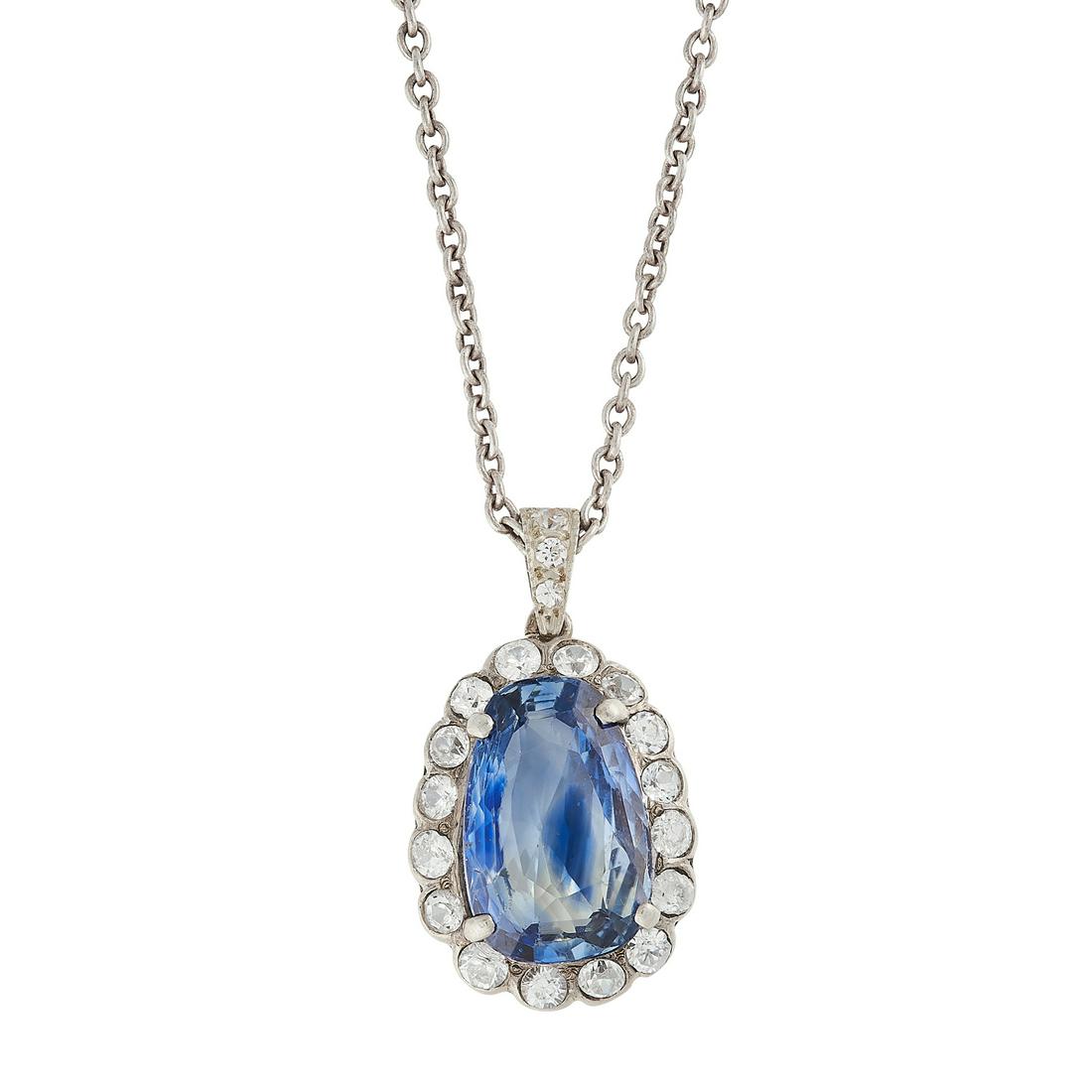 A SAPPHIRE AND WHITE SAPPHIRE PENDANT AND CHAIN in (1 of 1)