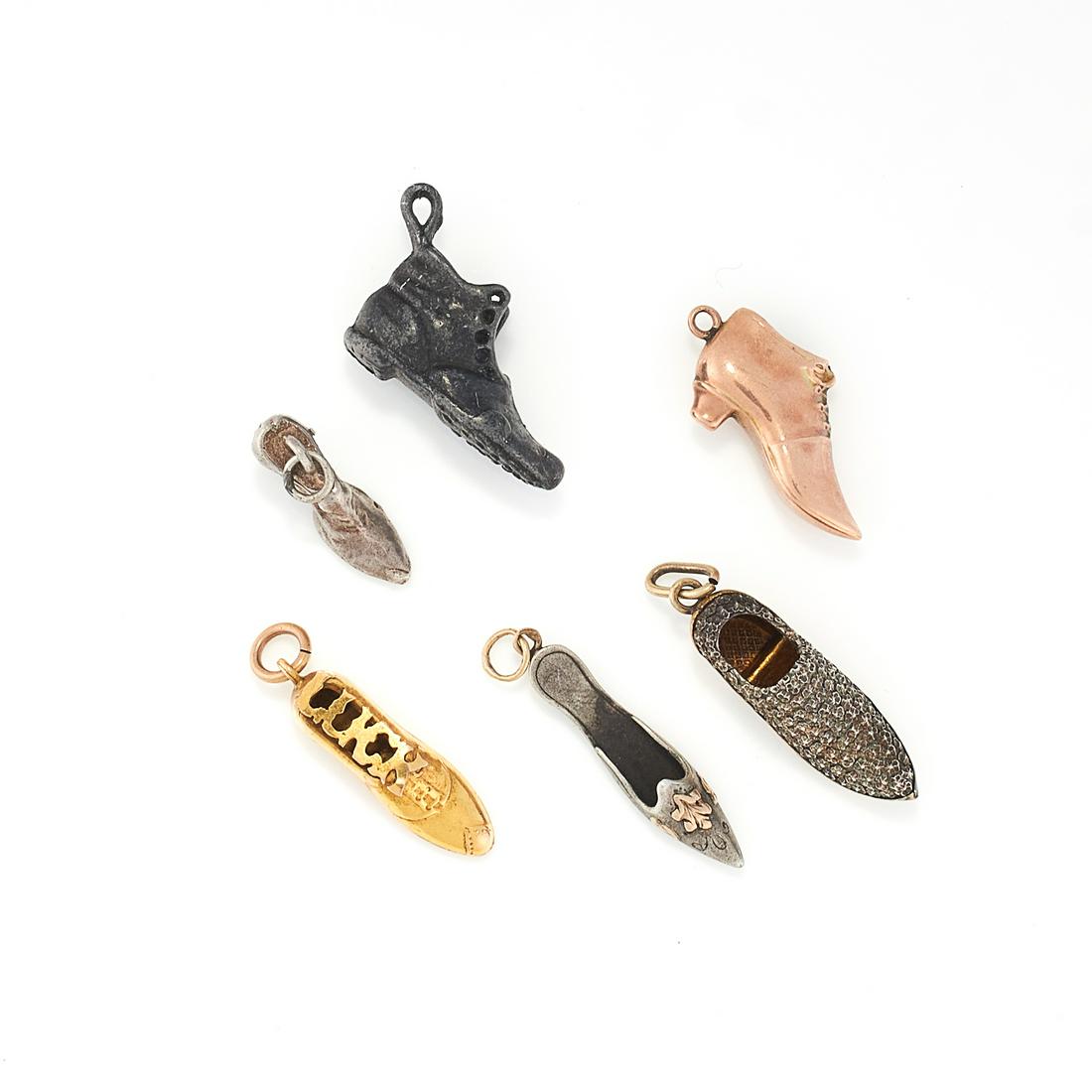A SET OF SIX SHOE CHARMS composing of six assorted shoe: A SET OF SIX SHOE CHARMS composing of six assorted shoe charms, inclusive three boots, one boot is stamped 9ct, total weight:10.2g.