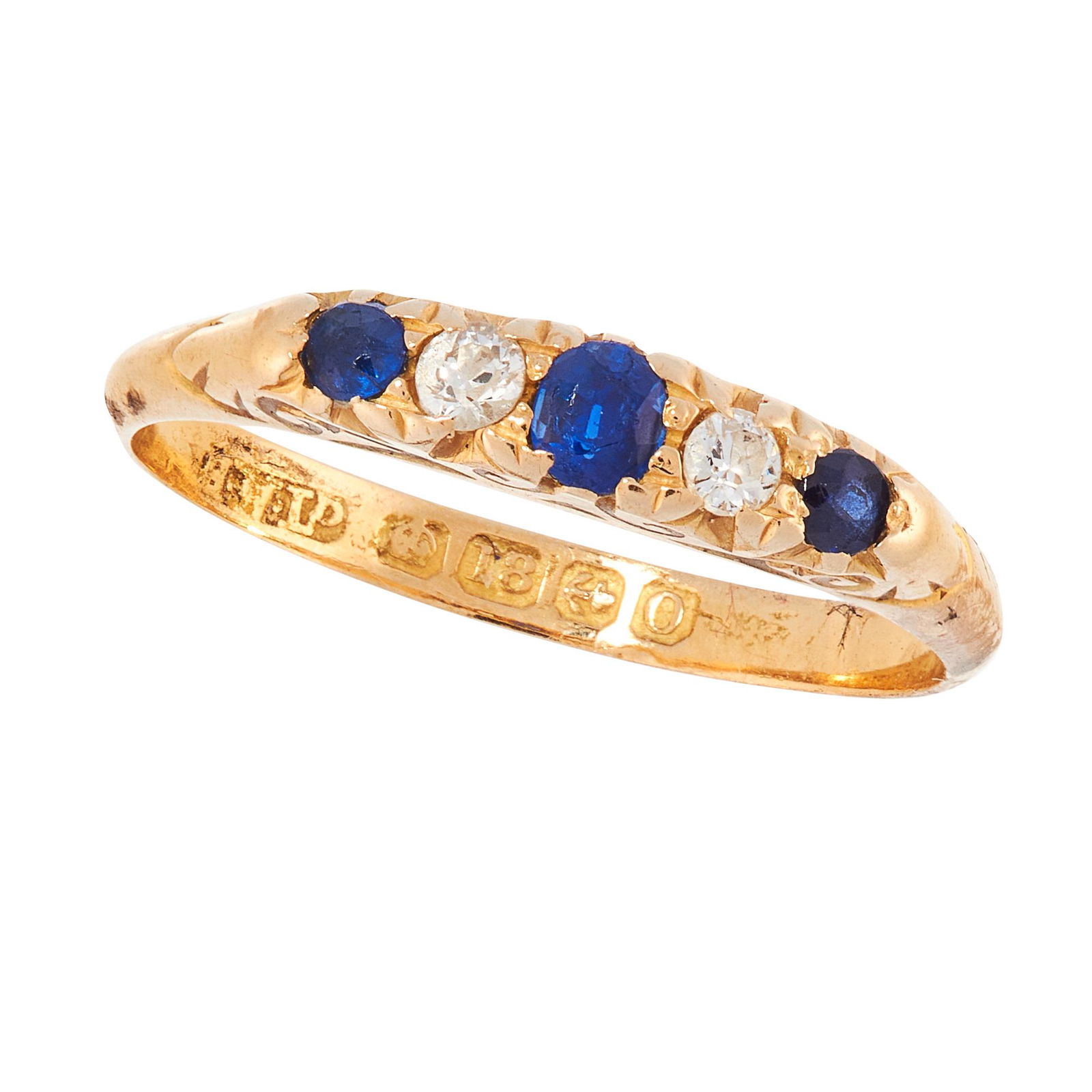 AN ANTIQUE SAPPHIRE AND DIAMOND DRESS RING, 1913 in: AN ANTIQUE SAPPHIRE AND DIAMOND DRESS RING, 1913 in 18ct yellow gold, set with a trio of graduated cushion cut blue sapphires punctuated by two old cut diamonds, full British hallmarks for Birmingham