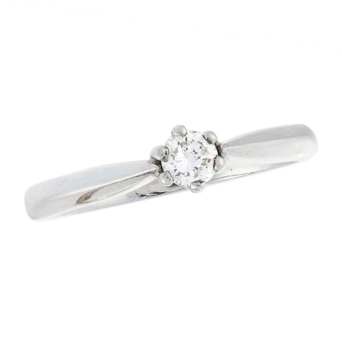 A SOLITAIRE DIAMOND DRESS RING in platinum, set with a (1 of 1)