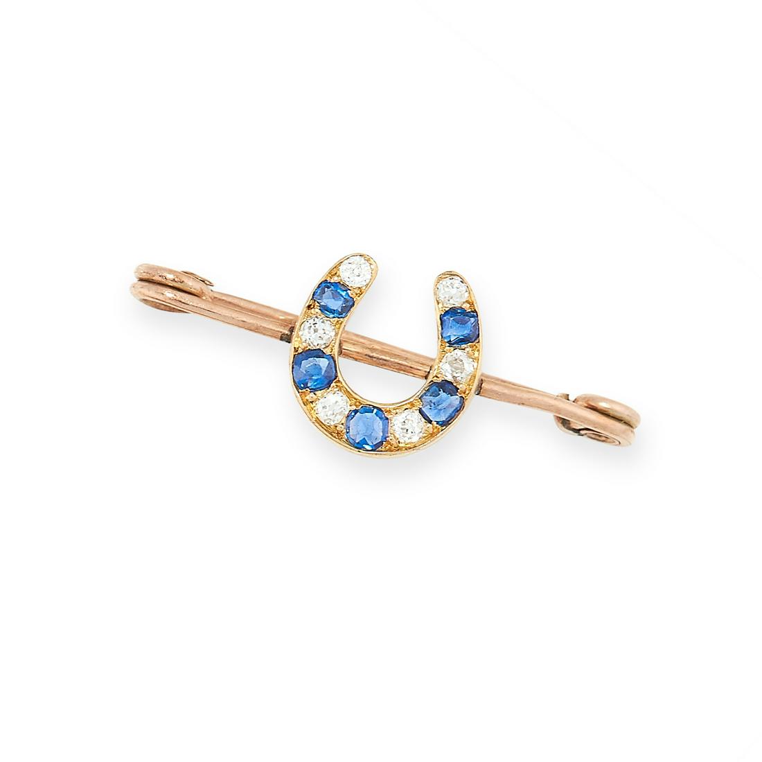 ANTIQUE DIAMOND AND SAPPHIRE HORSESHOE BROOCH in yellow: ANTIQUE DIAMOND AND SAPPHIRE HORSESHOE BROOCH in yellow gold, of bar design, set with a horseshoe motif set with alternating old cut diamonds and cushion cut sapphires, unmarked, 3.3cm, 2.2g.