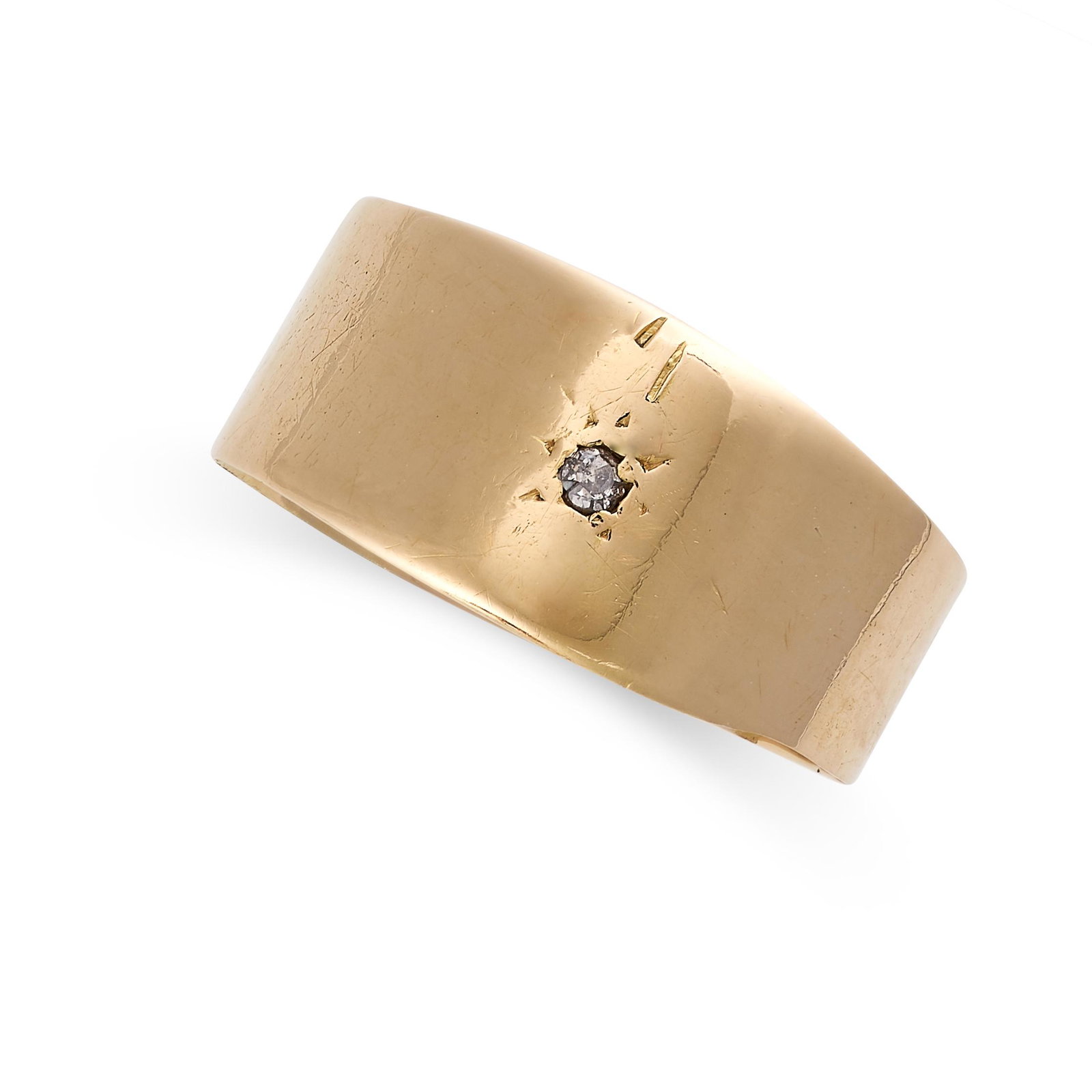 AN ANTIQUE DIAMOND BAND RING in yellow gold, the: AN ANTIQUE DIAMOND BAND RING in yellow gold, the tapering band set with a single cut diamond, British hallmarks (partly obscured), size P / 7.5, 3.2g. Guaranteed UK Christmas delivery subject to recei