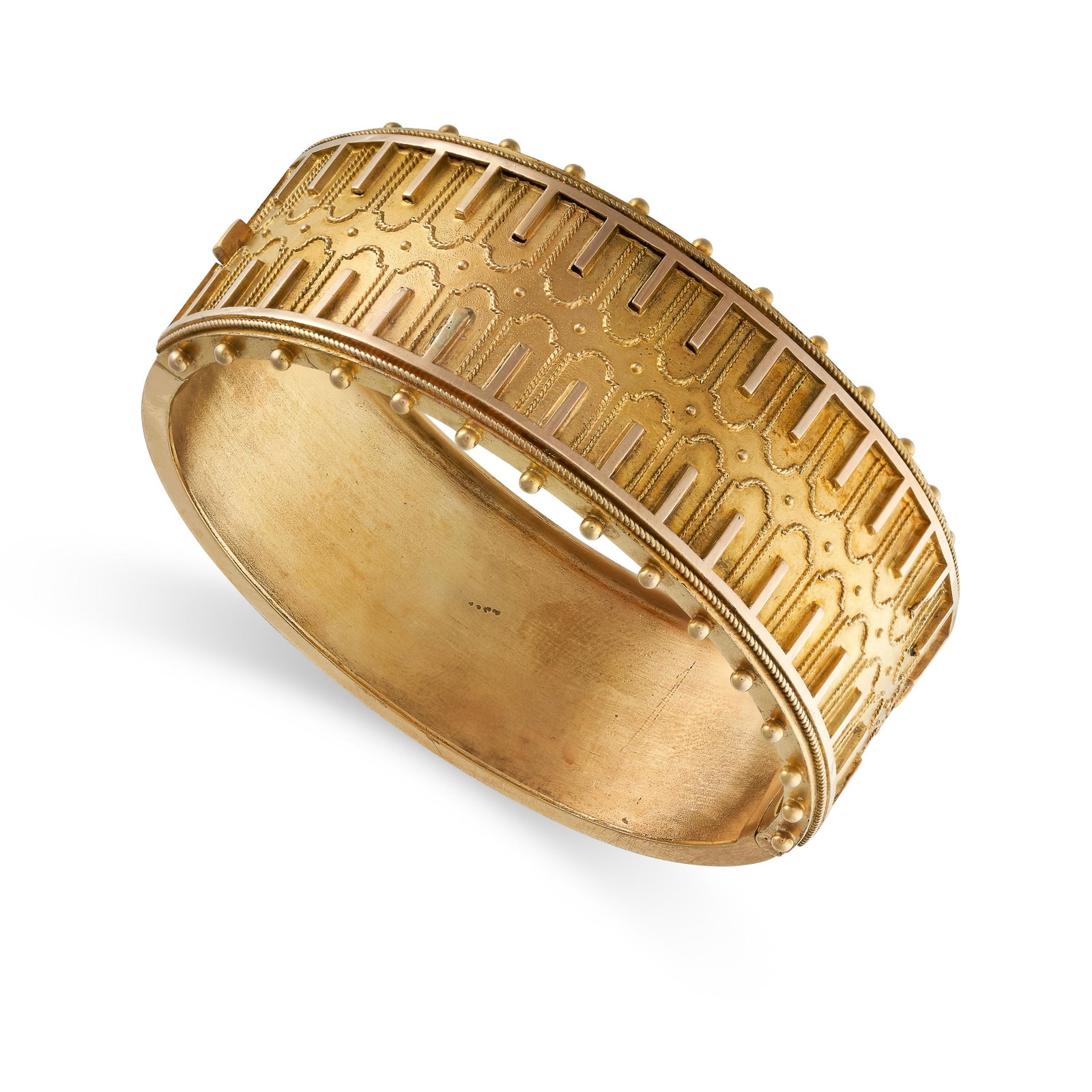 AN ANTIQUE CUFF BANGLE, 19TH CENTURY in yellow gold, in: AN ANTIQUE CUFF BANGLE, 19TH CENTURY in yellow gold, in the Etruscan revival manner, the hinged body decorated half way around with beaded and wirework designs, no assay marks, inner diameter 5.7cm, 2