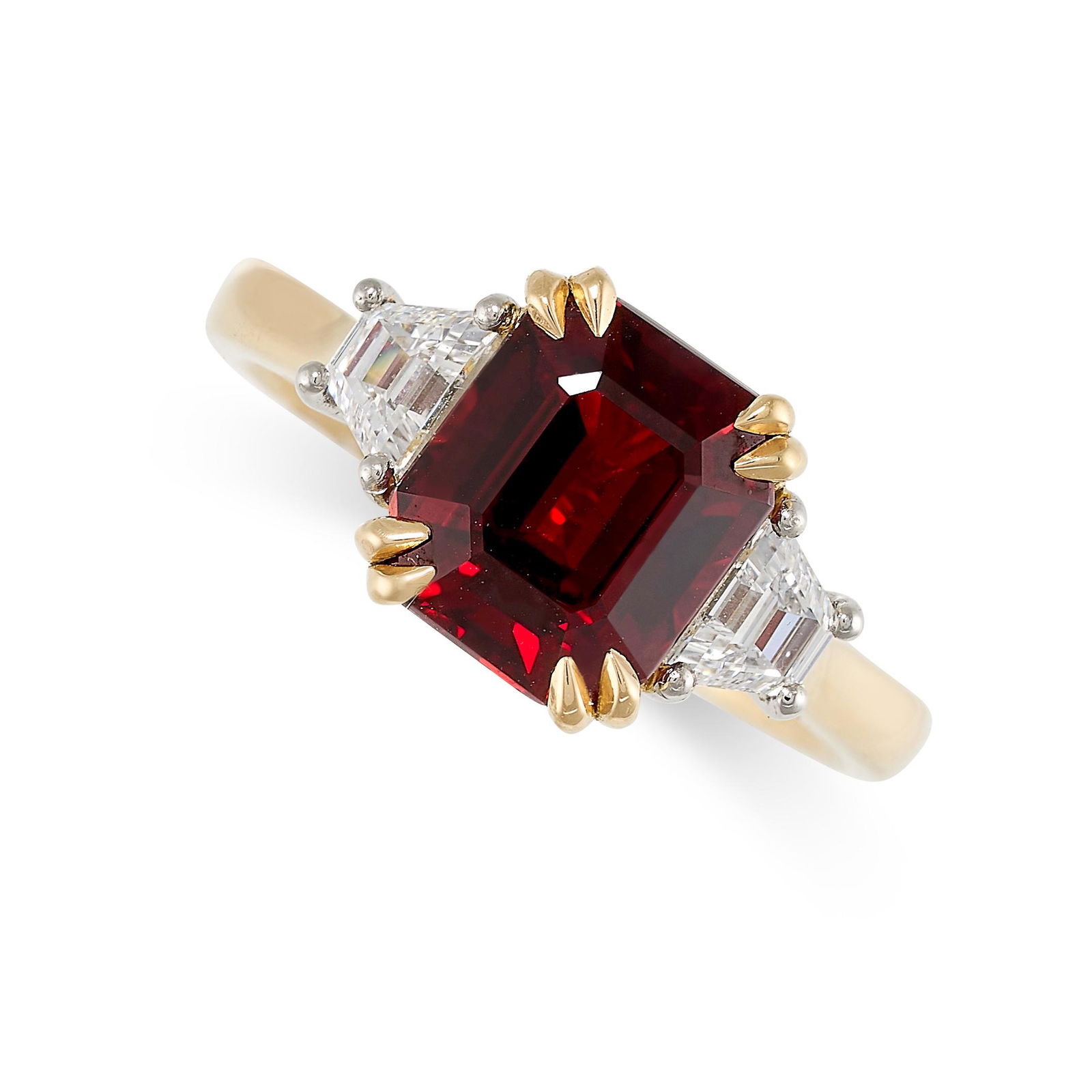 A RUBY AND DIAMOND RING in 18ct yellow gold, set with an emerald cut ruby of 3.37 carats, between: A RUBY AND DIAMOND RING in 18ct yellow gold, set with an emerald cut ruby of 3.37 carats, between fancy cut diamonds, British hallmarks for 18ct gold, size M / 6, 5.6g.