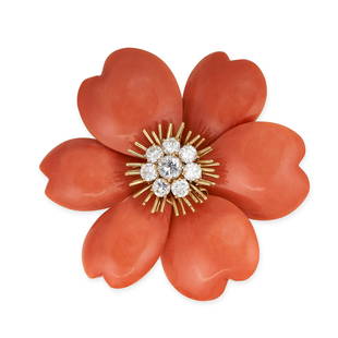 VAN CLEEF & ARPELS, A CORAL AND DIAMOND ROSE DE NOEL BROOCH in 18ct white gold, designed as a flower: VAN CLEEF & ARPELS, A CORAL AND DIAMOND ROSE DE NOEL BROOCH in 18ct white gold, designed as a flower with carved and polished coral petals around a central cluster of round brilliant cut diamonds,