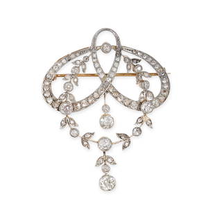 AN ANTIQUE BELLE EPOQUE DIAMOND BROOCH in yellow gold and platinum, the scrolling body set with old: AN ANTIQUE BELLE EPOQUE DIAMOND BROOCH in yellow gold and platinum, the scrolling body set with old cut and rose cut diamonds, suspending a laurel wreath with a further old cut diamond drop below,