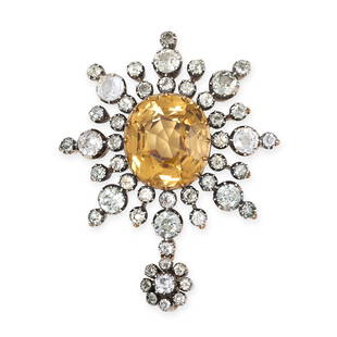 AN ANTIQUE YELLOW ZIRCON AND PASTE PENDANT in yellow gold and silver, set with an oval cut yellow: AN ANTIQUE YELLOW ZIRCON AND PASTE PENDANT in yellow gold and silver, set with an oval cut yellow zircon of 12.80 carats, within a border of old cut white paste stones, no assay marks, 4.5cm, 11.4g.