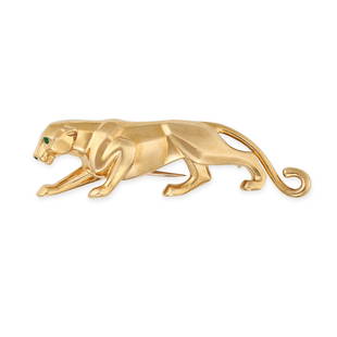 CARTIER, AN EMERALD AND ENAMEL PANTHERE BROOCH in 18ct yellow gold, designed to depict a panther,: CARTIER, AN EMERALD AND ENAMEL PANTHERE BROOCH in 18ct yellow gold, designed to depict a panther, the eyes set with emeralds, and with black enamel to the nose, signed Cartier and numbered, French
