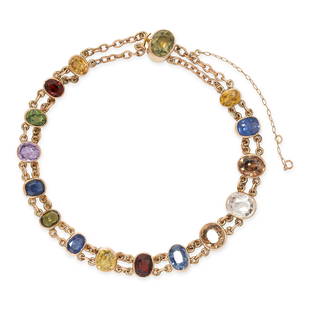 AN ANTIQUE SAPPHIRE AND ZIRCON BRACELET in yellow gold, set with a row of sixteen graduated cushion: AN ANTIQUE SAPPHIRE AND ZIRCON BRACELET in yellow gold, set with a row of sixteen graduated cushion and oval cut sapphires and zircons in various colours including blue, yellow, red, green, purple,