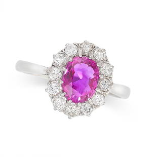 A BURMA NO HEAT RUBY AND DIAMOND DRESS RING set with an oval cut ruby of 1.63 carats within a border: A BURMA NO HEAT RUBY AND DIAMOND DRESS RING set with an oval cut ruby of 1.63 carats within a border of round brilliant cut diamonds, no assay marks, size M / 6, 3.8g. Accompanied by a gemmological