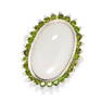 A MOONSTONE AND DIOPSIDE RING set with a moonstone cabochon of 12.50 carats in a border of round cut