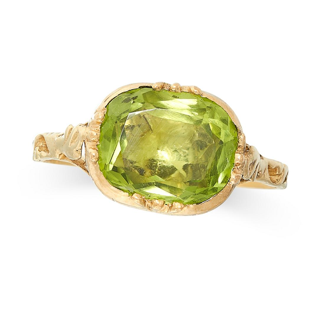 A PERIDOT DRESS RING in yellow gold, set with a cushion cut peridot, no assay marks, size L / 5.5, (1 of 2)