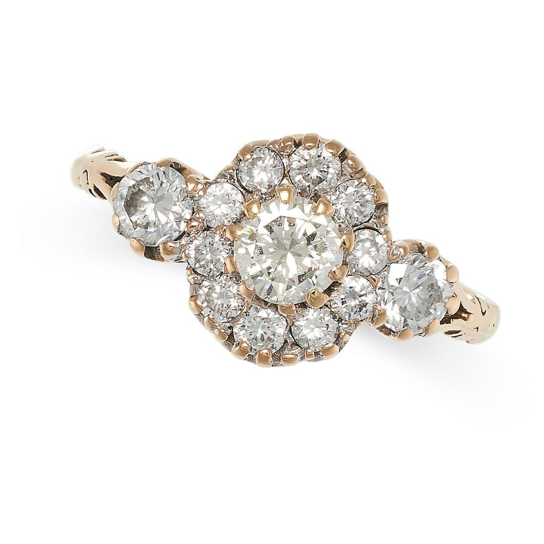 A DIAMOND CLUSTER RING in 18ct gold, set with a round brilliant cut diamond of 0.36 carats in a (1 of 2)