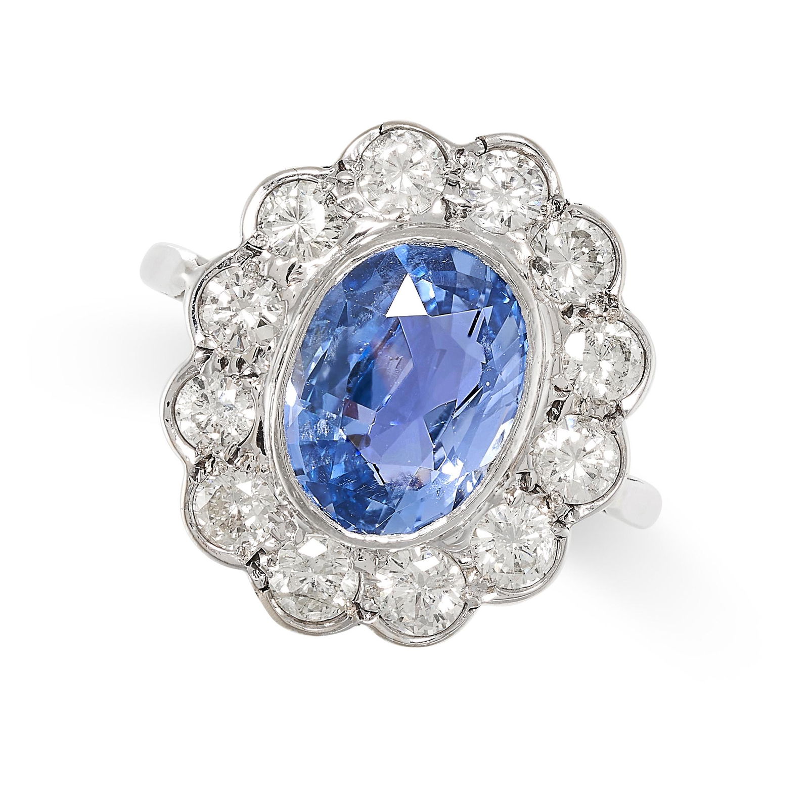A CEYLON NO HEAT SAPPHIRE AND DIAMOND CLUSTER RING set with an oval cut blue sapphire of 3.39 carats (1 of 2)