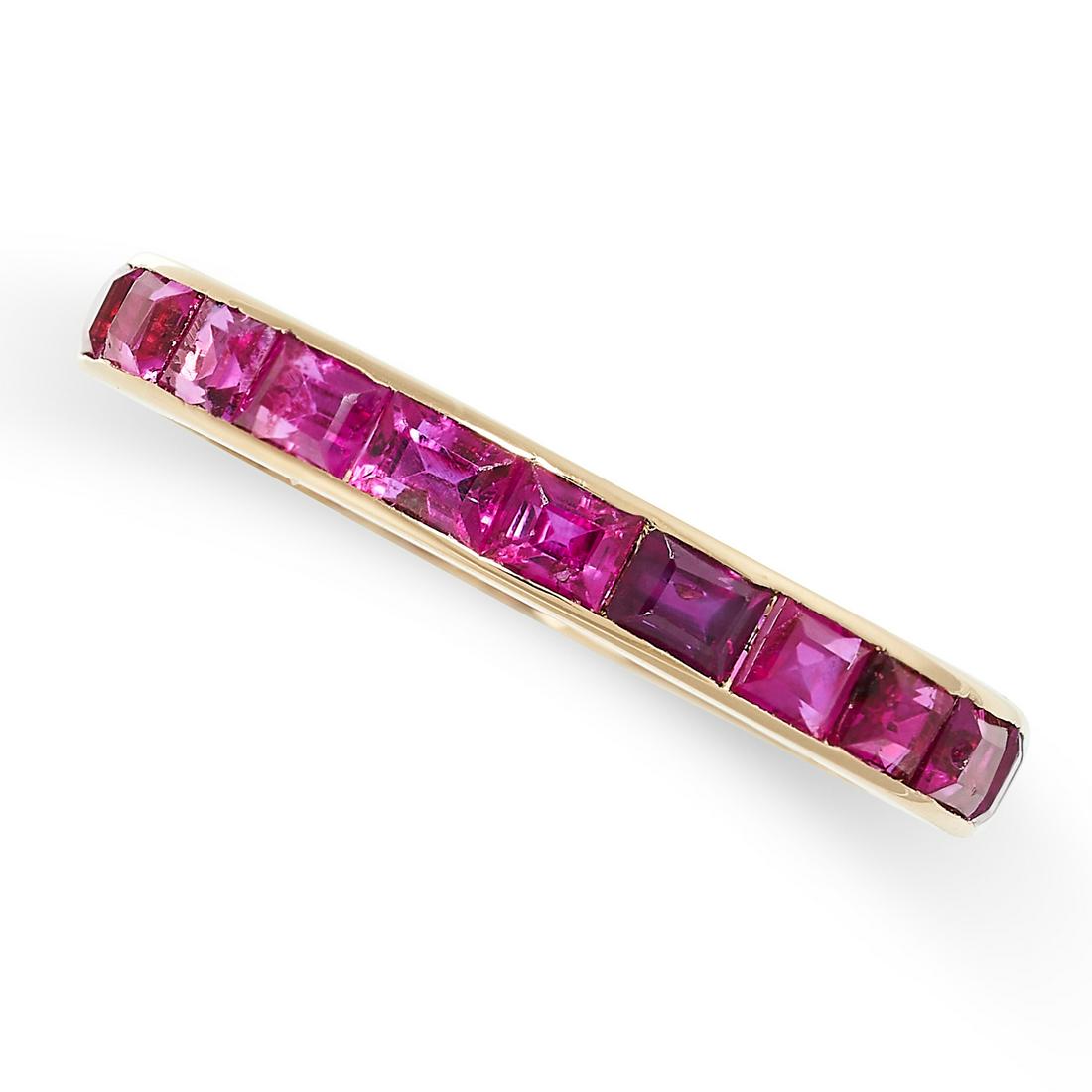 A RUBY ETERNITY RING the band channel set with step cut rubies totalling 2.60 carats, no assay (1 of 2)