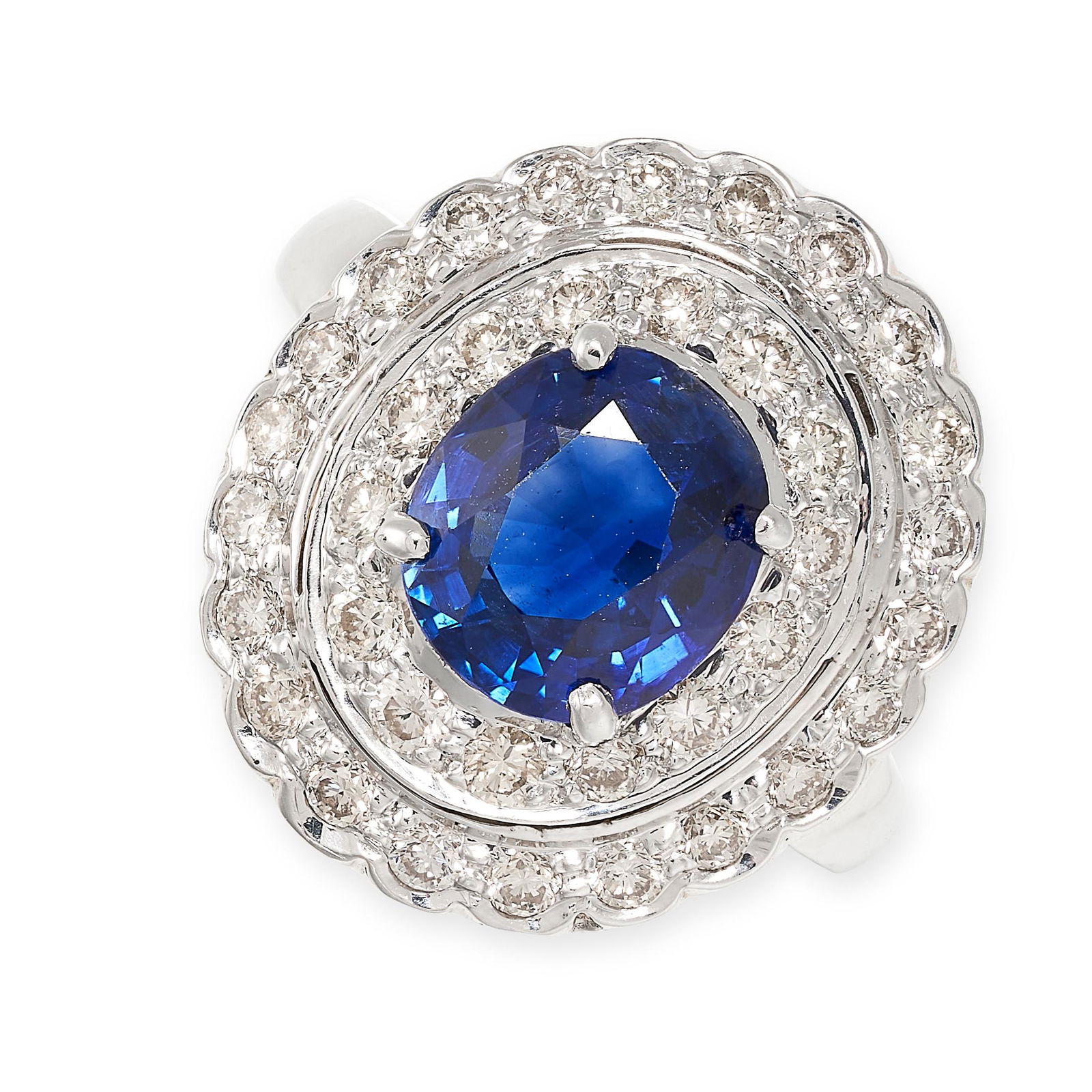 A SAPPHIRE AND DIAMOND RING in 18ct white gold, set with an oval cut sapphire of 3.13 carats in a (1 of 2)