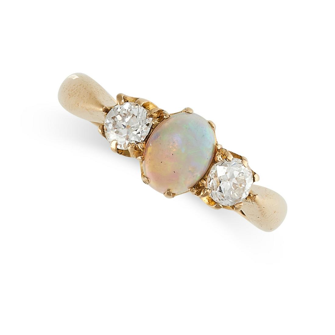 AN OPAL AND DIAMOND THREE STONE RING in 18ct yellow gold, set with an opal cabochon between two old (1 of 2)