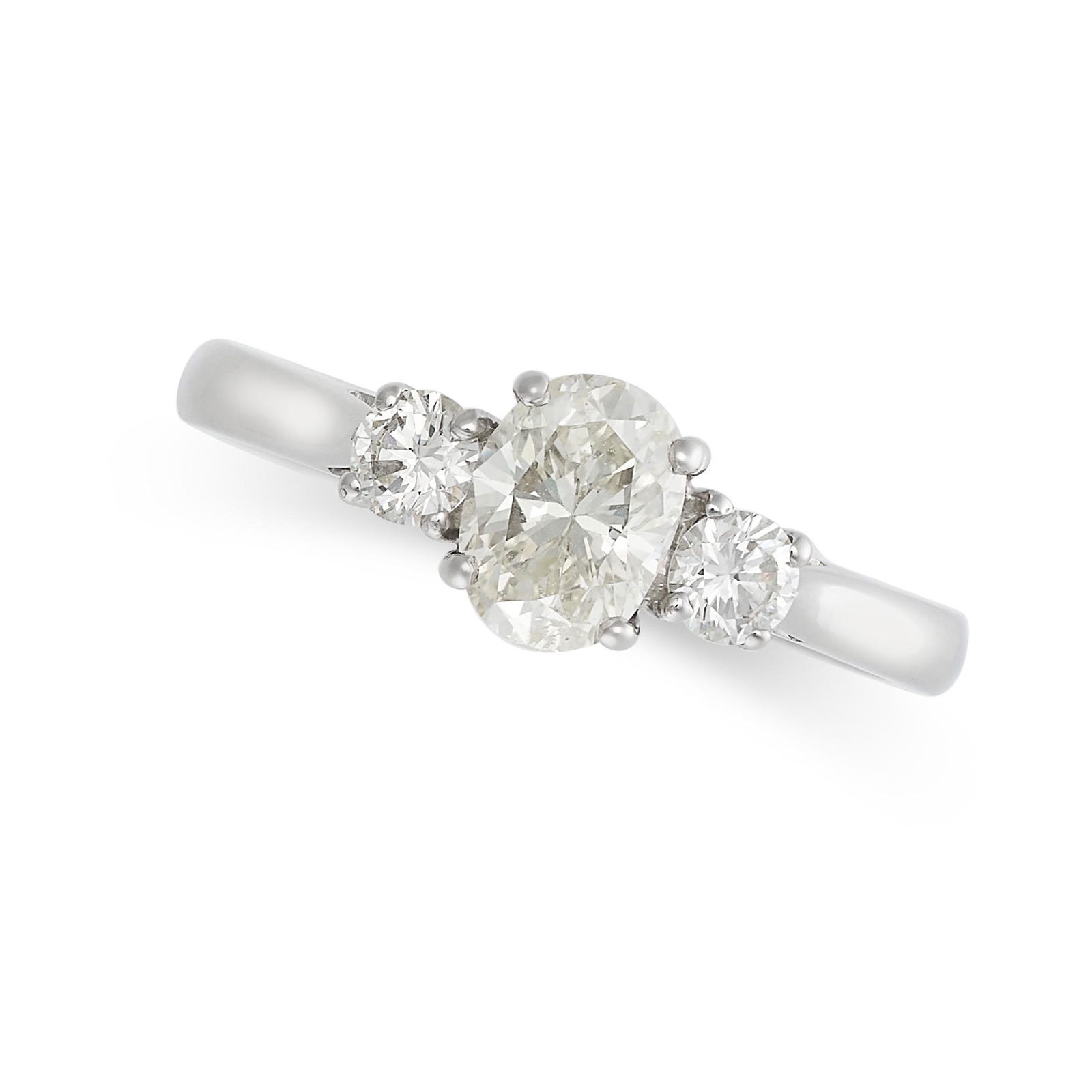 A DIAMOND THREE STONE RING in platinum, set with a central oval cut diamond of 0.85 carats between (1 of 2)