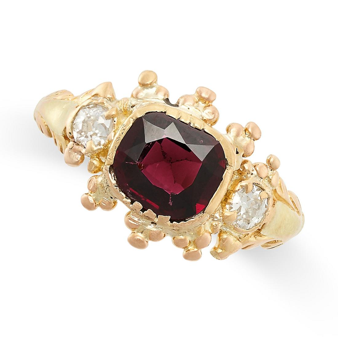 A GARNET AND DIAMOND RING in 15ct yellow gold, set with a cushion cut garnet between two old cut (1 of 2)