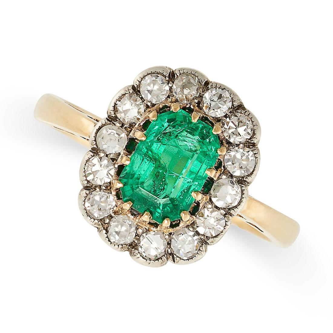 AN EMERALD AND DIAMOND CLUSTER RING, EARLY 20TH CENTURY in yellow and silver, set  with a step cut (1 of 2)