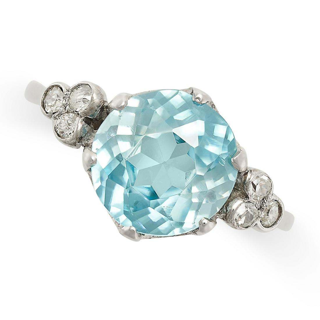 A BLUE ZIRCON AND DIAMOND RING set with a round cut blue zircon of 3.73 carats accented by trios of (1 of 2)
