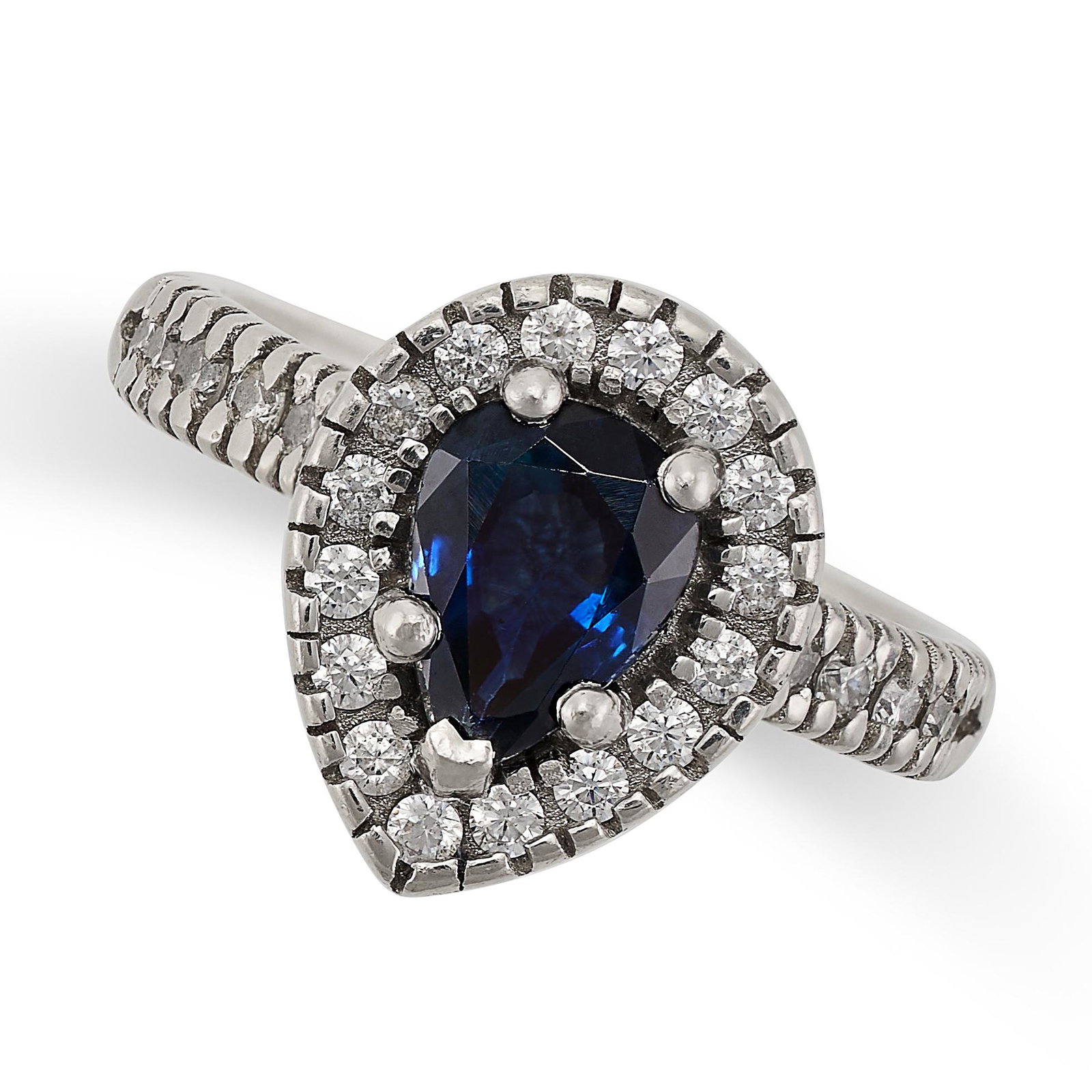 A SAPPHIRE AND DIAMOND RING in platinum, set with a pear cut sapphire in a border of round cut (1 of 2)
