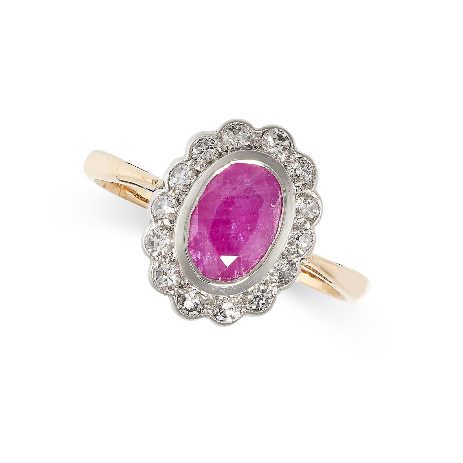 A RUBY AND DIAMOND RING in yellow gold, set with an oval cut ruby in a cluster of single cut (1 of 2)