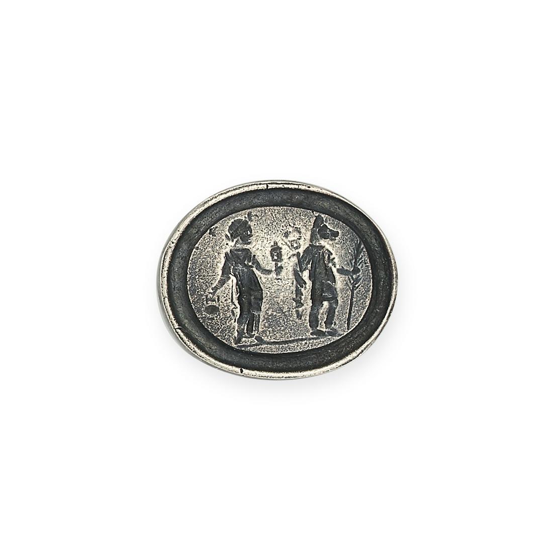 NO RESERVE - A SILVER INTAGLIO depicting Isis with Anubis with the dog's head carrying a palm: NO RESERVE - A SILVER INTAGLIO depicting Isis with Anubis with the dog's head carrying a palm branch, 1.6cm, 4.5g.