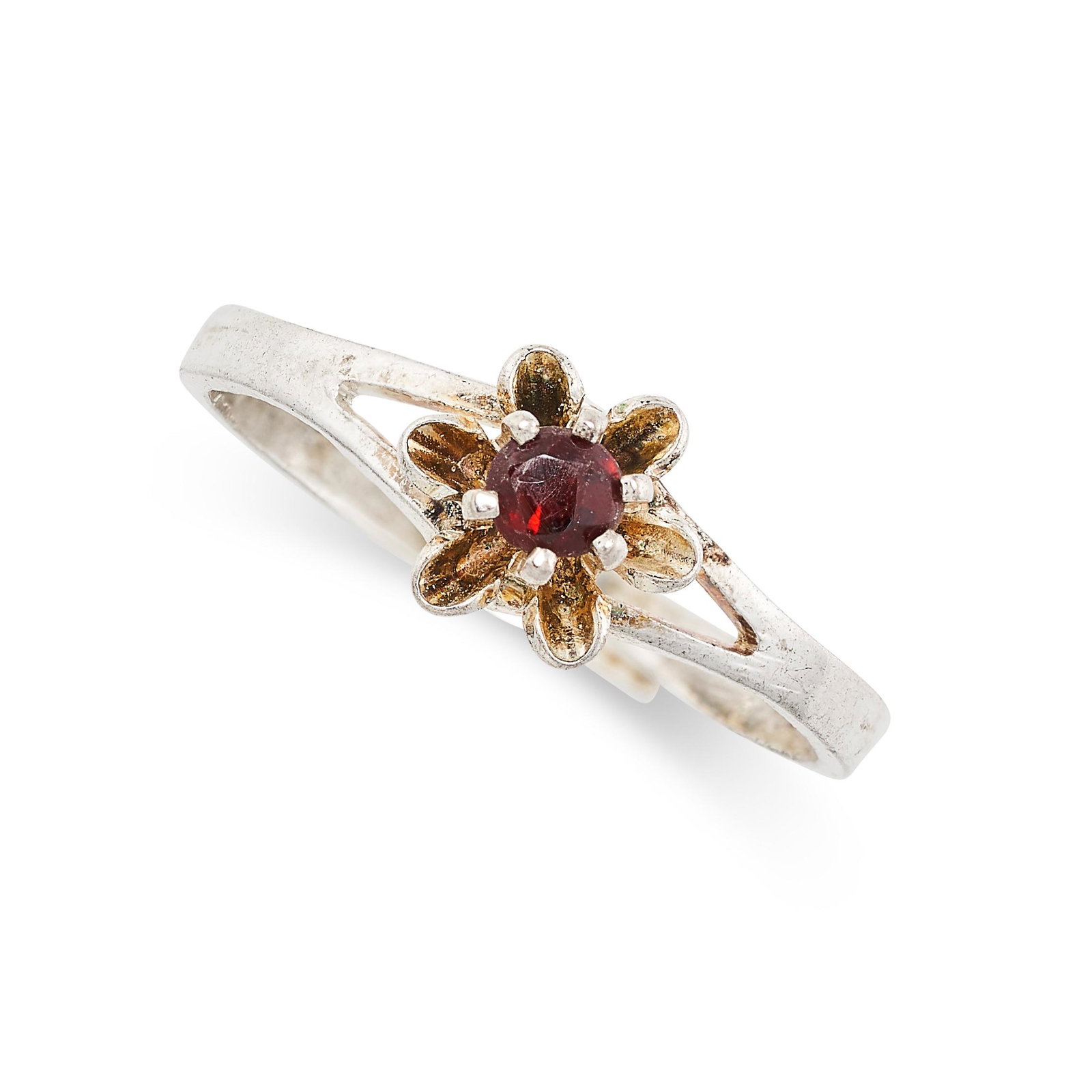 A GARNET FLOWER RING in white gold, set with a round cut garnet over a stylised flower design, no (1 of 2)