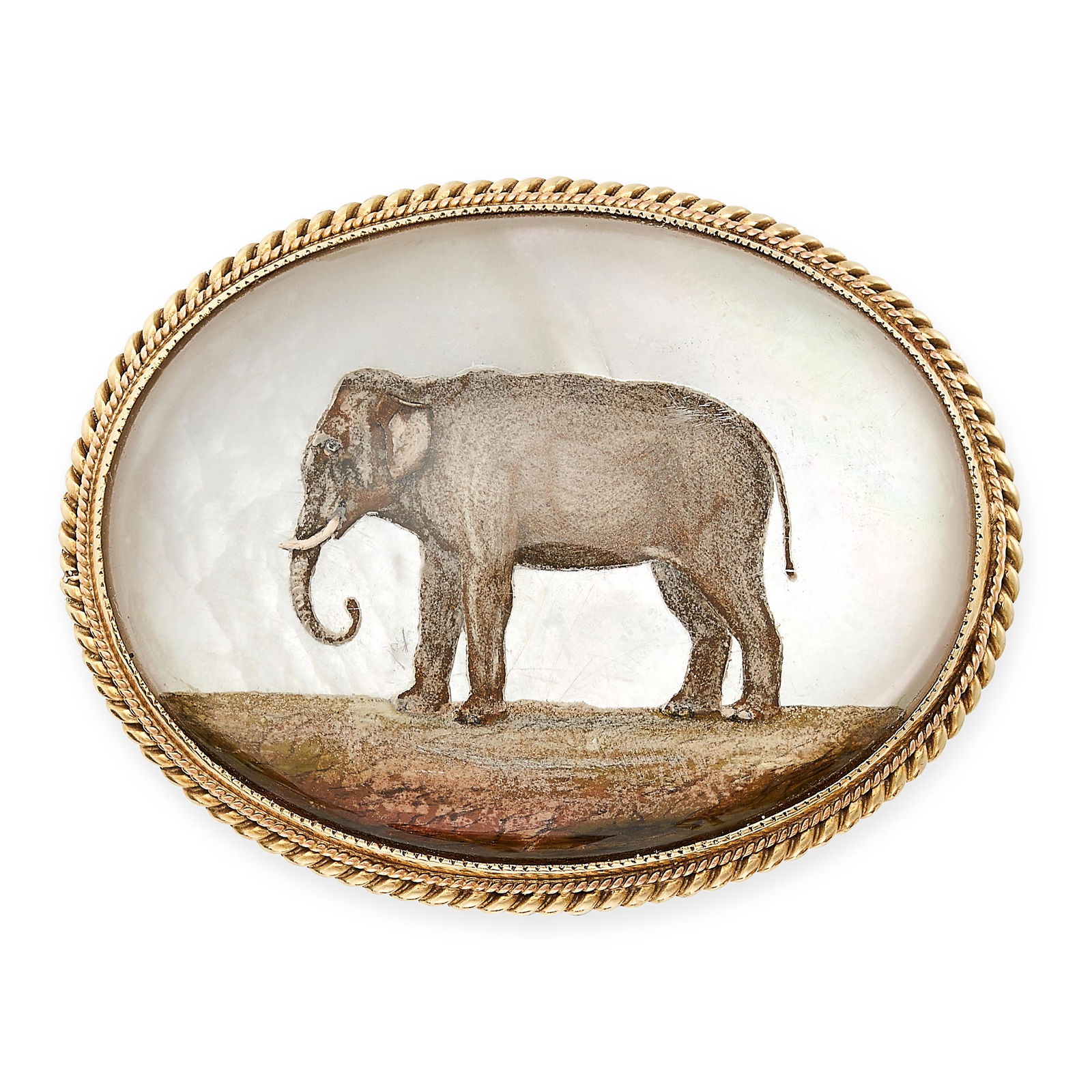 AN ANTIQUE REVERSE CARVED INTAGLIO ELEPHANT BROOCH in 14ct yellow gold, set with an oval reverse: AN ANTIQUE REVERSE CARVED INTAGLIO ELEPHANT BROOCH in 14ct yellow gold, set with an oval reverse carved intaglio of an elephant on a mother of pearl background, stamped 14K, 3.7cm, 17.9g.