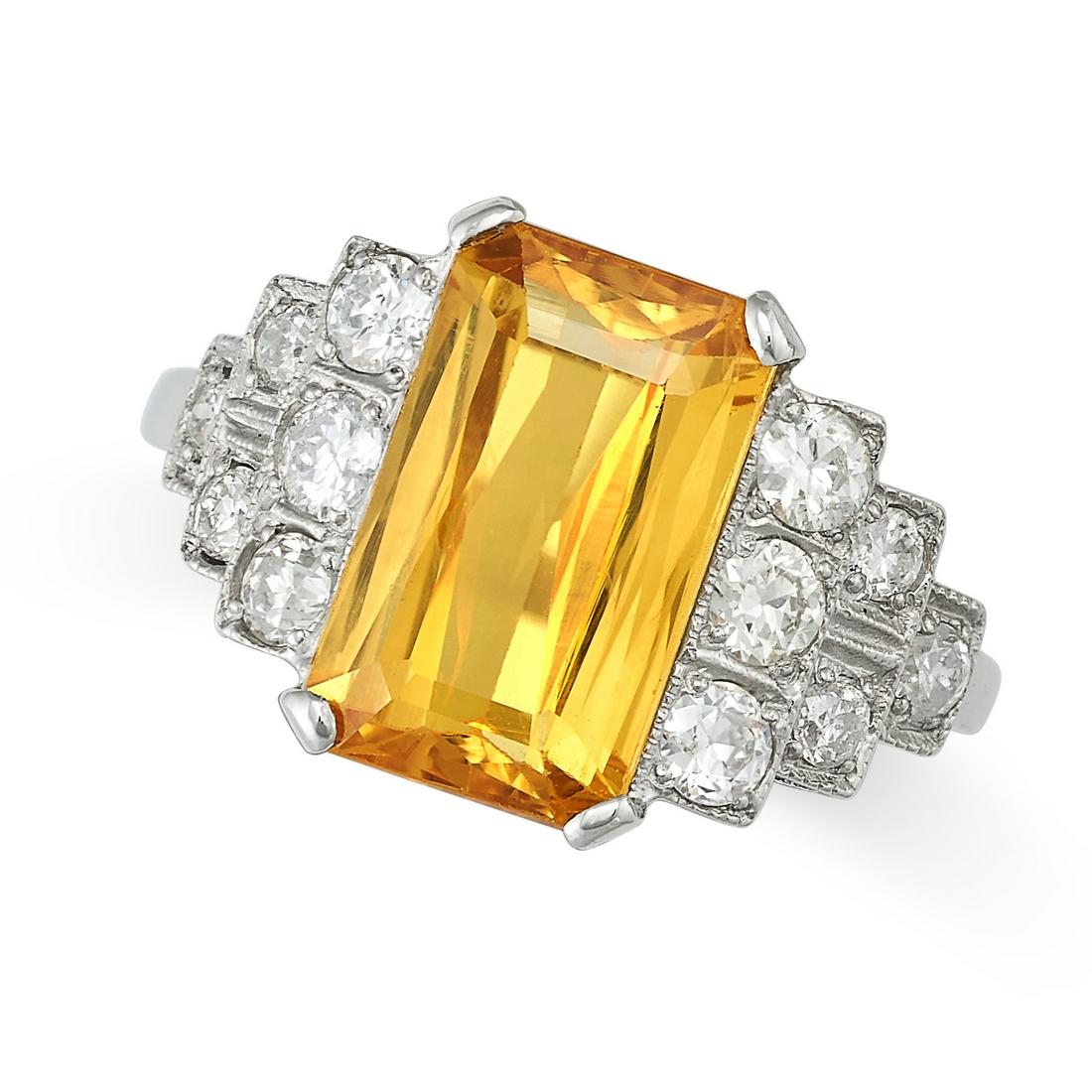 A YELLOW SAPPHIRE AND DIAMOND RING in platinum, set with an octagonal mixed cut of approximately (1 of 1)