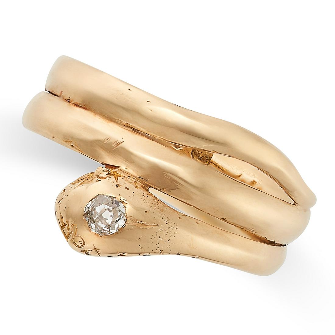 A DIAMOND SNAKE RING in 18ct yellow gold, designed as a coiling snake, the head set with an old cut (1 of 2)