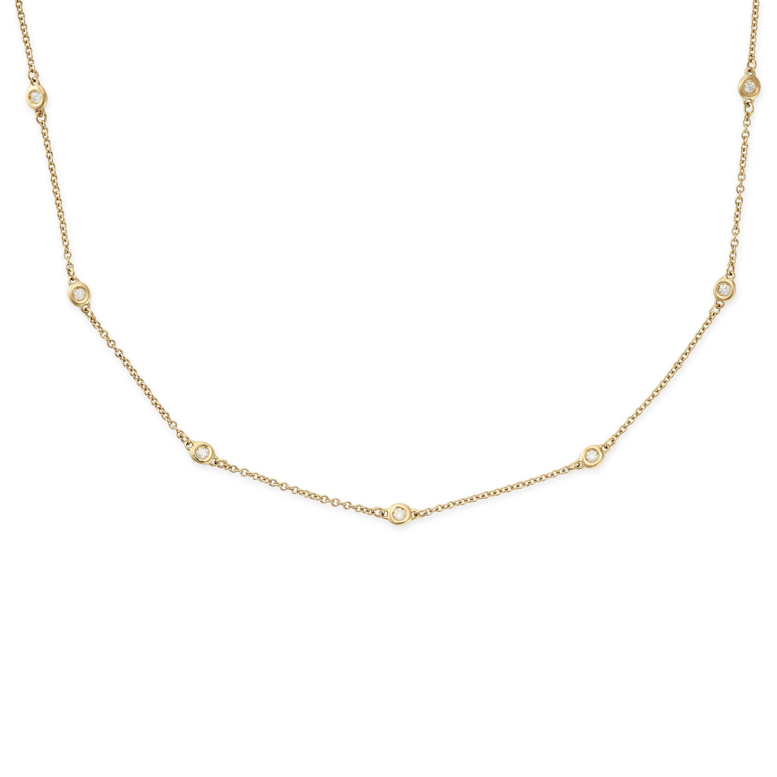 A DIAMOND CHAIN NECKLACE in 18ct yellow gold, in the manner of Diamonds By The Yard the chain set: A DIAMOND CHAIN NECKLACE in 18ct yellow gold, in the manner of Diamonds By The Yard the chain set with seven round brilliant cut diamonds, stamped 750, 42.5cm, 2.8g.