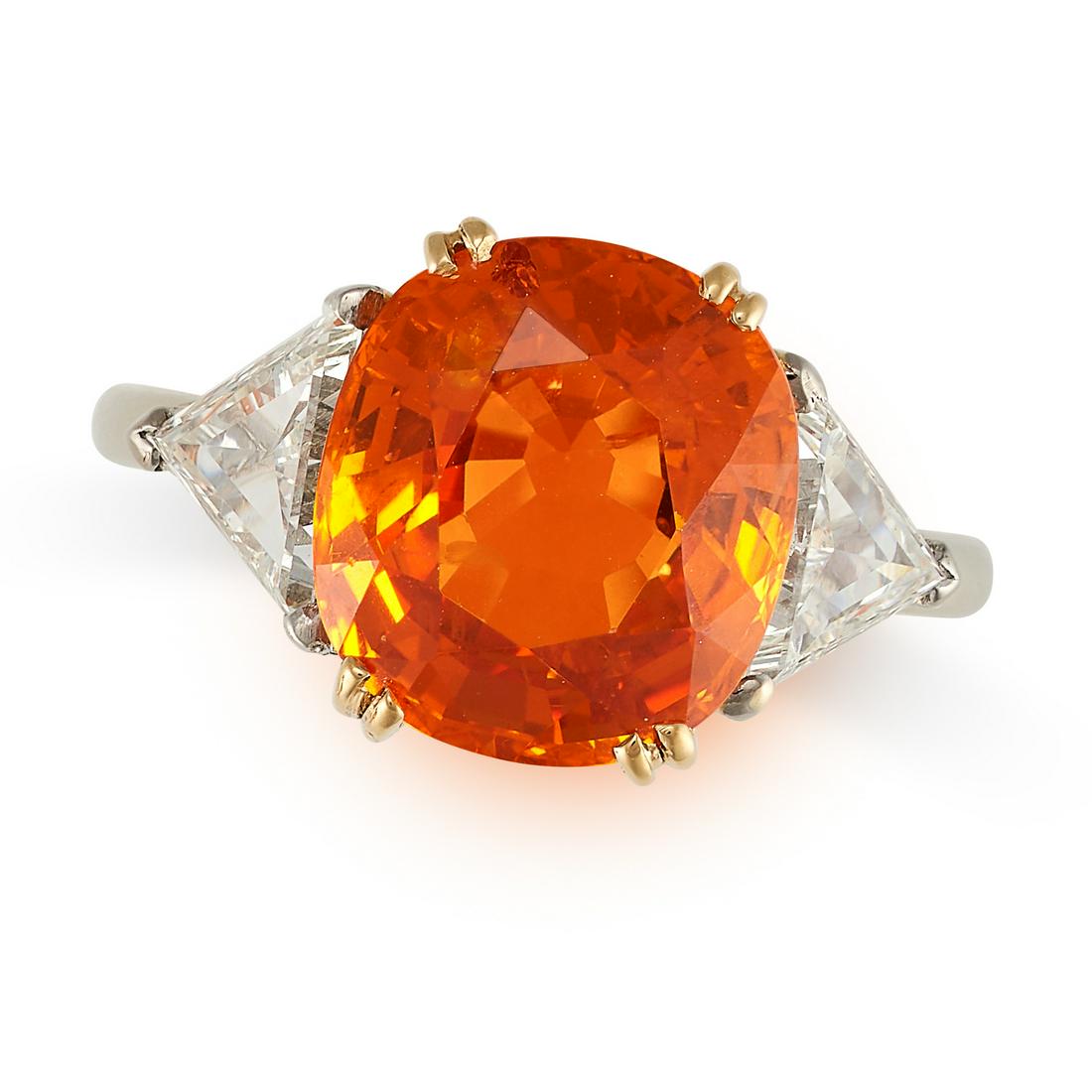 AN ORANGE SAPPHIRE AND DIAMOND RING in 18ct white and yellow gold, set with a cushion cut orange (1 of 1)