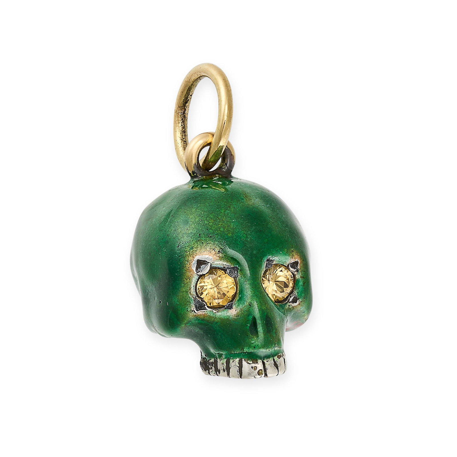 A YELLOW SAPPHIRE AND ENAMEL SKULL CHARM / PENDANT in yellow gold and silver, designed as a skull: A YELLOW SAPPHIRE AND ENAMEL SKULL CHARM / PENDANT in yellow gold and silver, designed as a skull decorated with green enamel, the eyes set with round cut yellow sapphires, no assay marks, 2.1cm, 4.6g