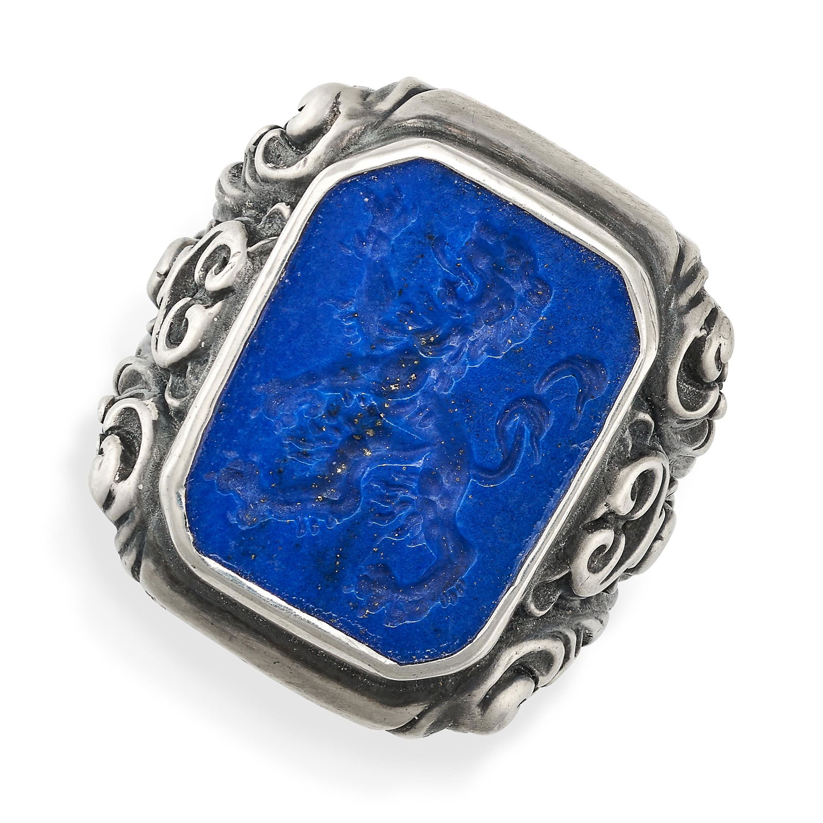 A LAPIS LAZULI INTAGLIO DRESS RING in silver, set with a lapis lazuli intaglio carved to depict a (1 of 2)