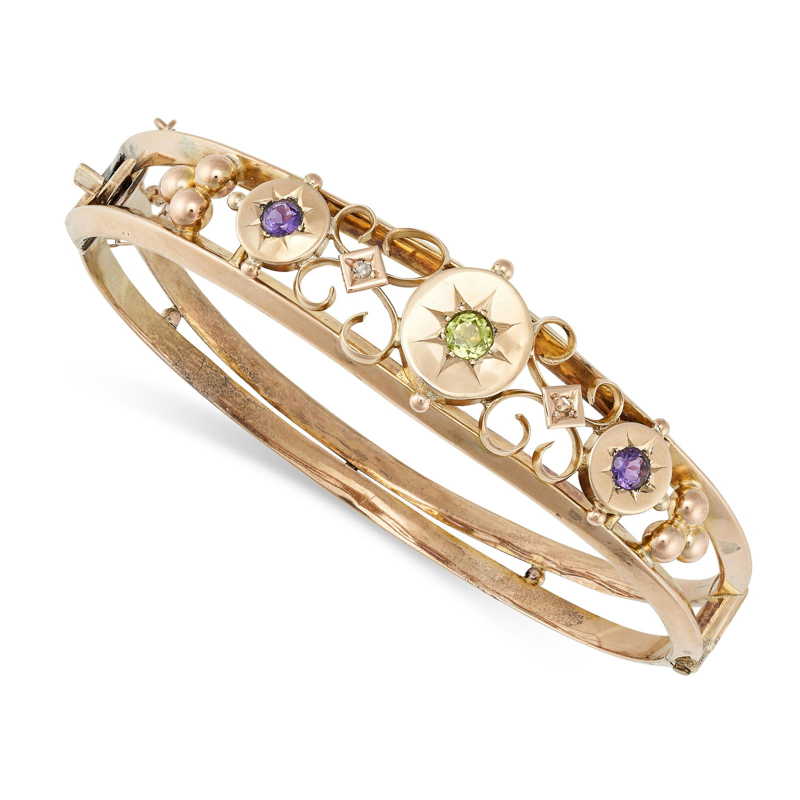 AN ANTIQUE EDWARDIAN AMETHYST AND PERIDOT SUFFRAGETTE BANGLE in 9ct yellow gold, the openwork ban... (1 of 1)
